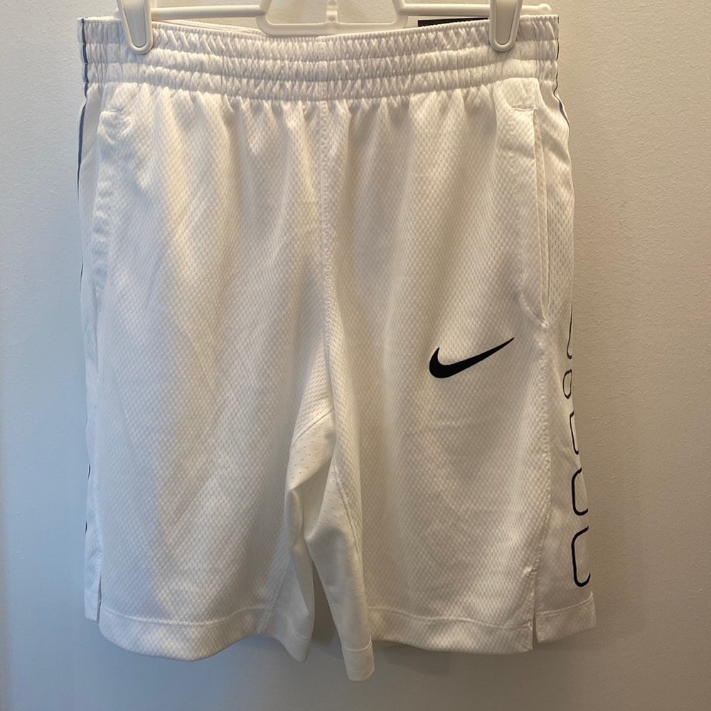 Girls YL white Nike basketball shorts. Never worn- tags still on